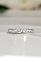delicate asymmetric diamond wedding ring with 15 brilliant cut diamonds and shared claw setting in platinum - Christine Sadler