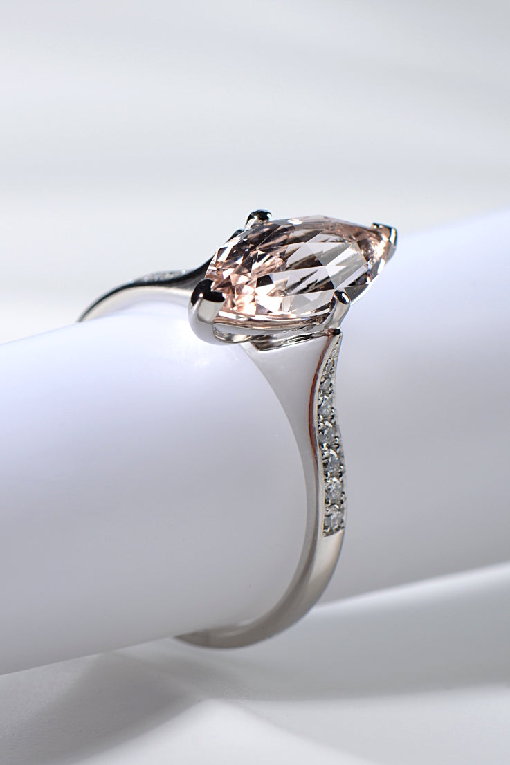 platinum ring with marquise shaped morganite with a briolette cut and diamond accents in the shoulders one-of-a-kind engagement ring from Christine Sadler