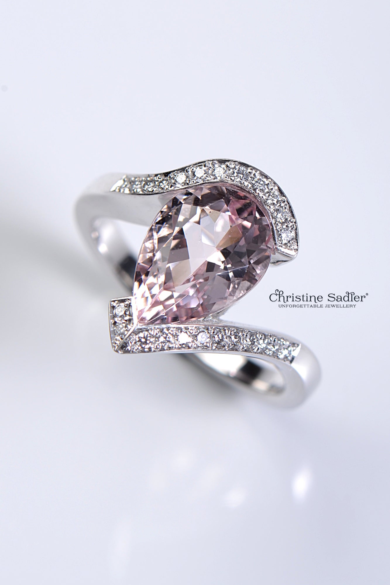 platinum large pear cut morganite twist ring with diamonds set in the band - Christine Sadler handcrafted engagement ring
