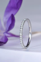 narrow diamond wedding ring in platinum with diamonds all the way round, sometimes called a full eternity ring