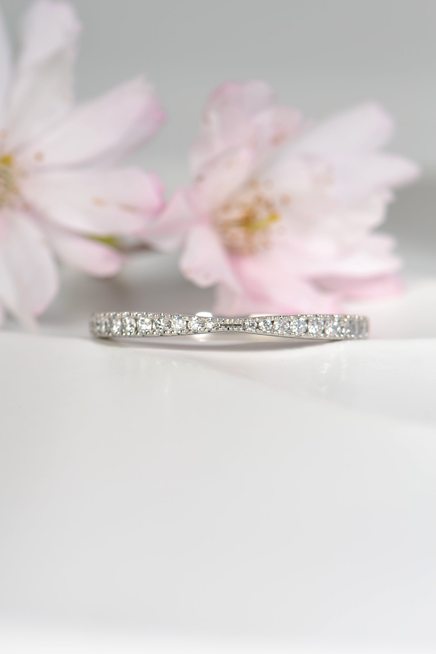 modern platinum and diamond wedding ring for a woman