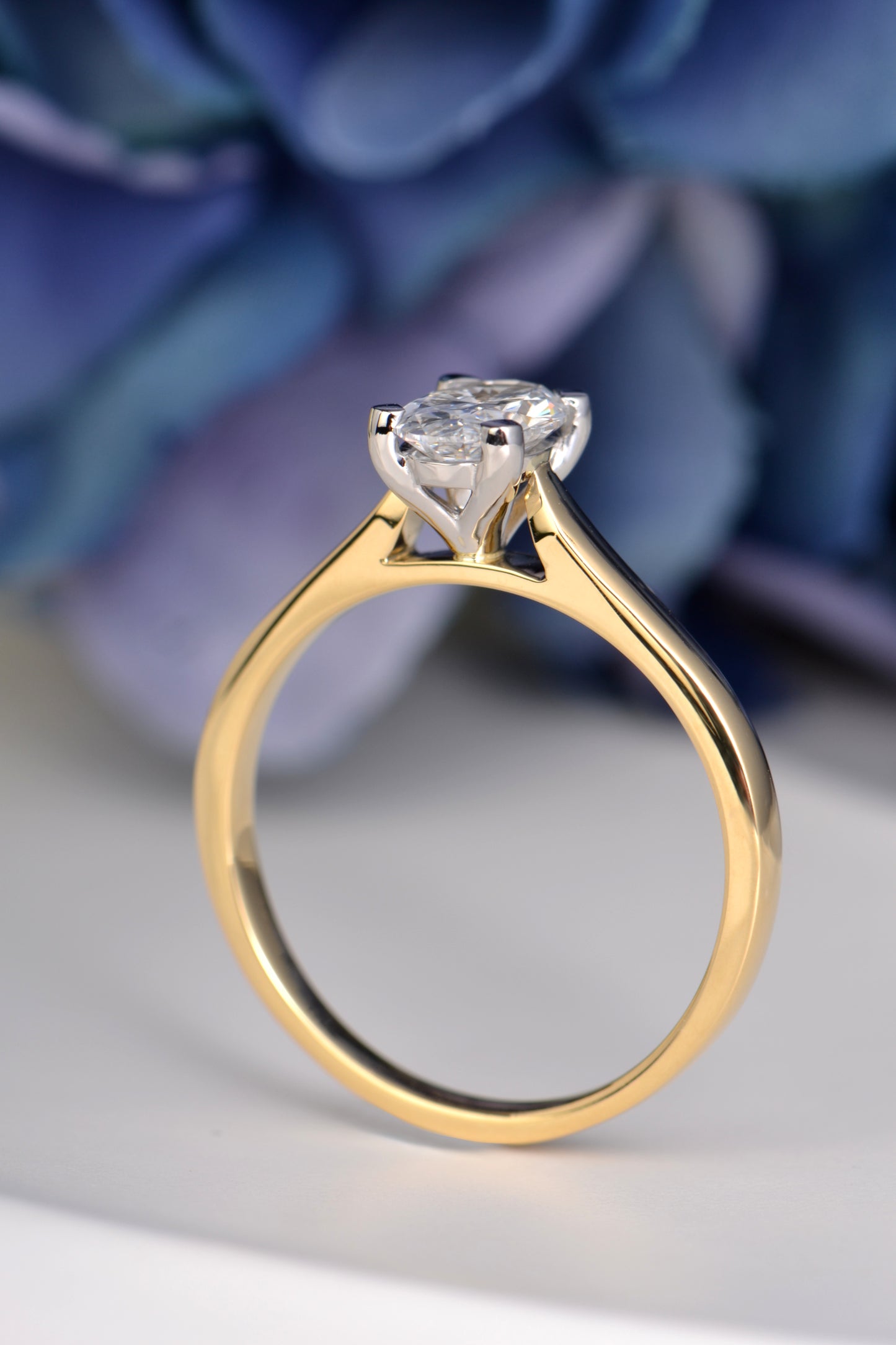 Side profile of oval lab-grown diamond ring in 18ct gold with platinum claws, crafted in the UK