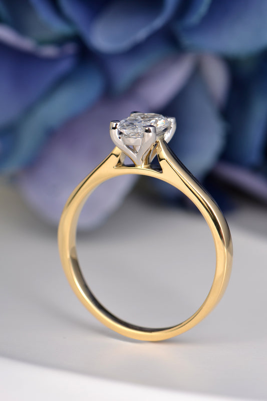 Side profile of oval lab-grown diamond ring in 18ct gold with platinum claws, crafted in the UK