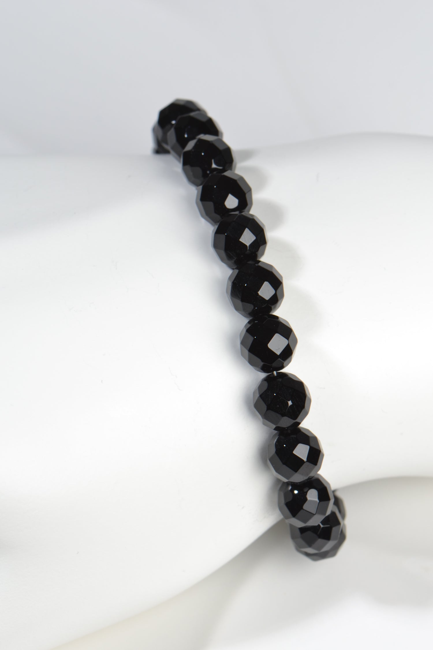 faceted real onyx bracelet with sterling silver adjustable silver clasp.