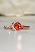 Fairypools orange sapphire ring in 18ct rose gold with diamond crescent, front view.
