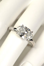 Platinum 3 carat east–west oval lab-grown diamond ring on mannequin hand, crafted in Britain with sustainable luxury design