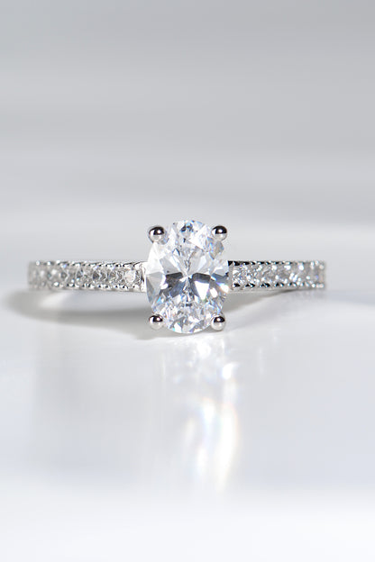 modern high quality oval cut diamond engagement ring, made in the UK. This contemporary platinum ring style has diamonds in the shoulders.