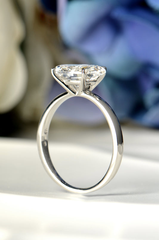 Platinum 3 carat east–west oval lab-grown diamond ring, angled view showing brilliance and sleek modern setting