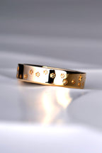 designer unique ring in gold with paw prints and stars