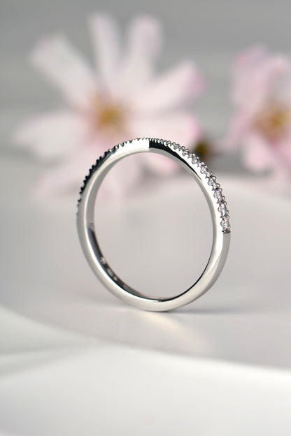 British made platinum diamond wedding ring shaped to fit next to an engagement ring
