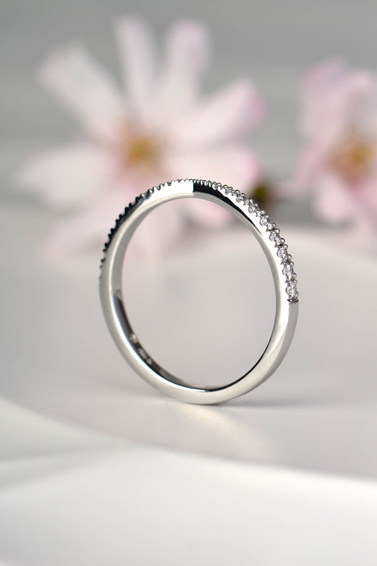 British made platinum diamond wedding ring shaped to fit next to an engagement ring