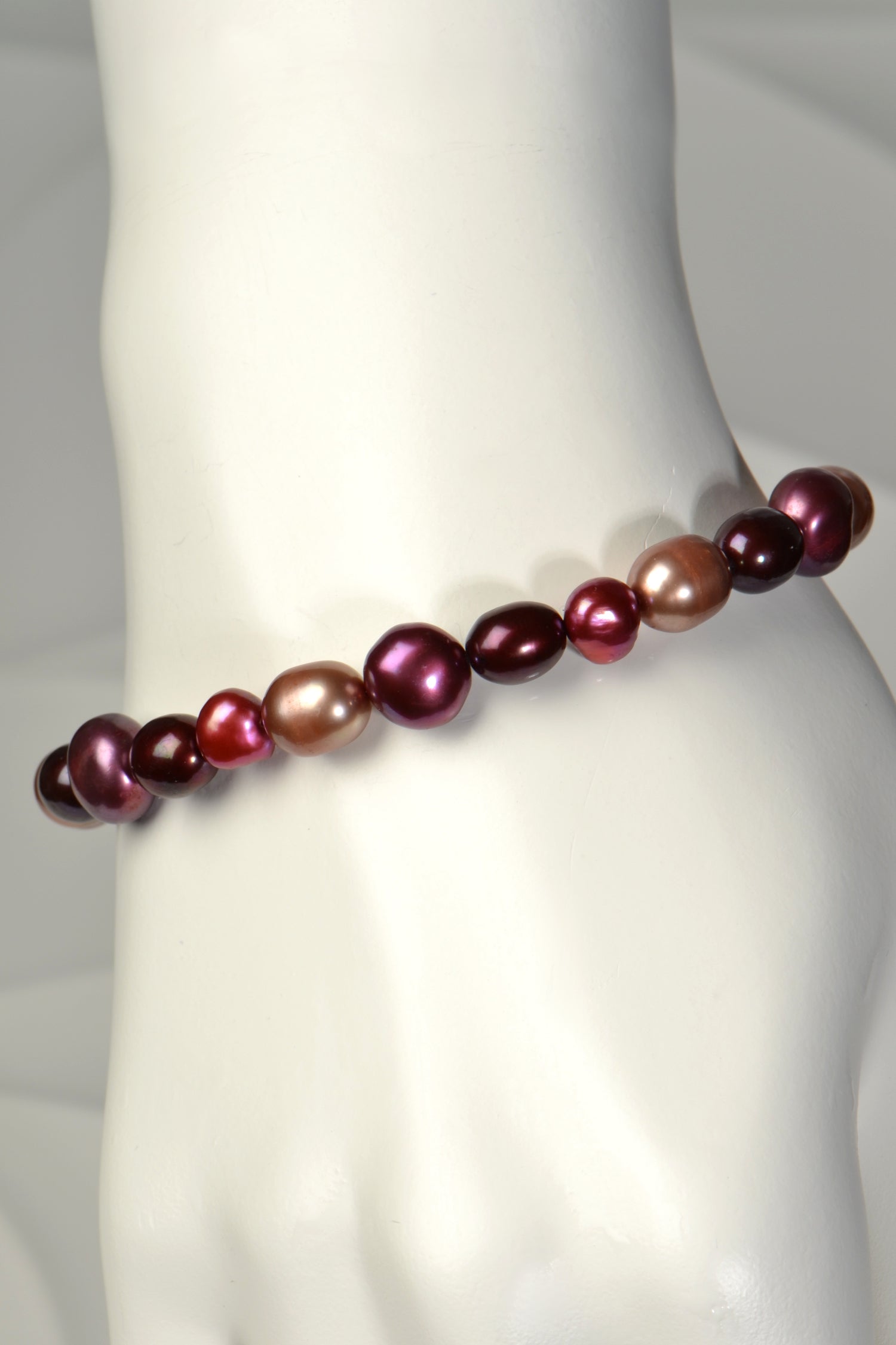 one of a kind real pearl bracelet with pearls in purple, red and biscuit colours