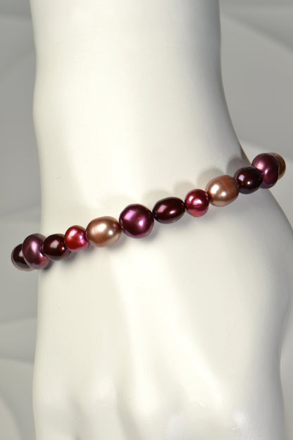 one of a kind real pearl bracelet with pearls in purple, red and biscuit colours