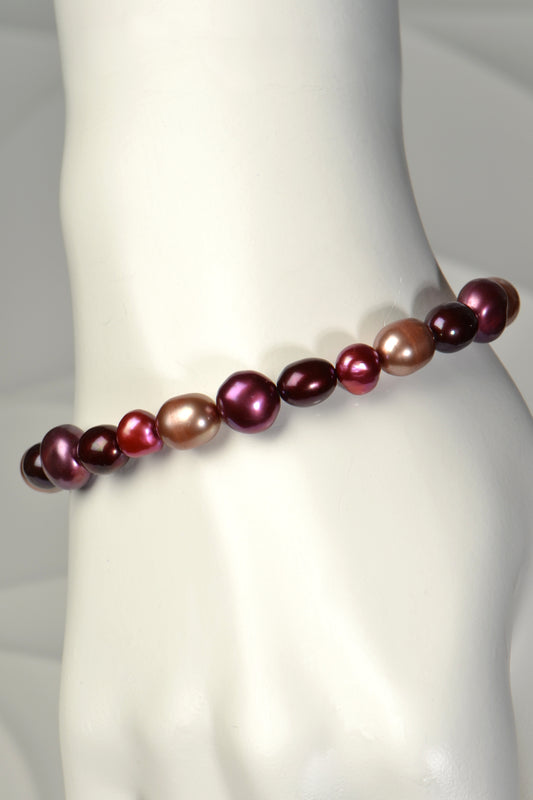 one of a kind real pearl bracelet with pearls in purple, red and biscuit colours