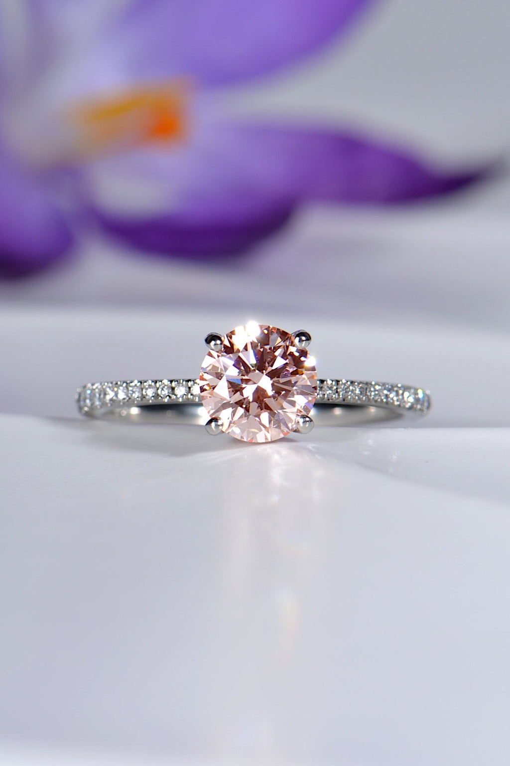modern engagement ring design set with a one carat pink lab diamond and diamond in the shoulders - Christine Sadler