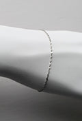 delicate platinum bracelet that sparkles shown on a white mannequin wrist