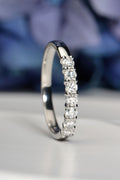 British handmade 7-stone half carat diamond ring, claw-set, worn on hand, lab-grown diamonds