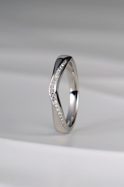 U shaped platinum diamond set wedding ring that is special and different as it has a ribbon of diamonds on the curved edge