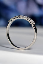 Side view of British handmade 7-stone platinum ring, claw-set diamonds, highlighting band craftsmanship and detail