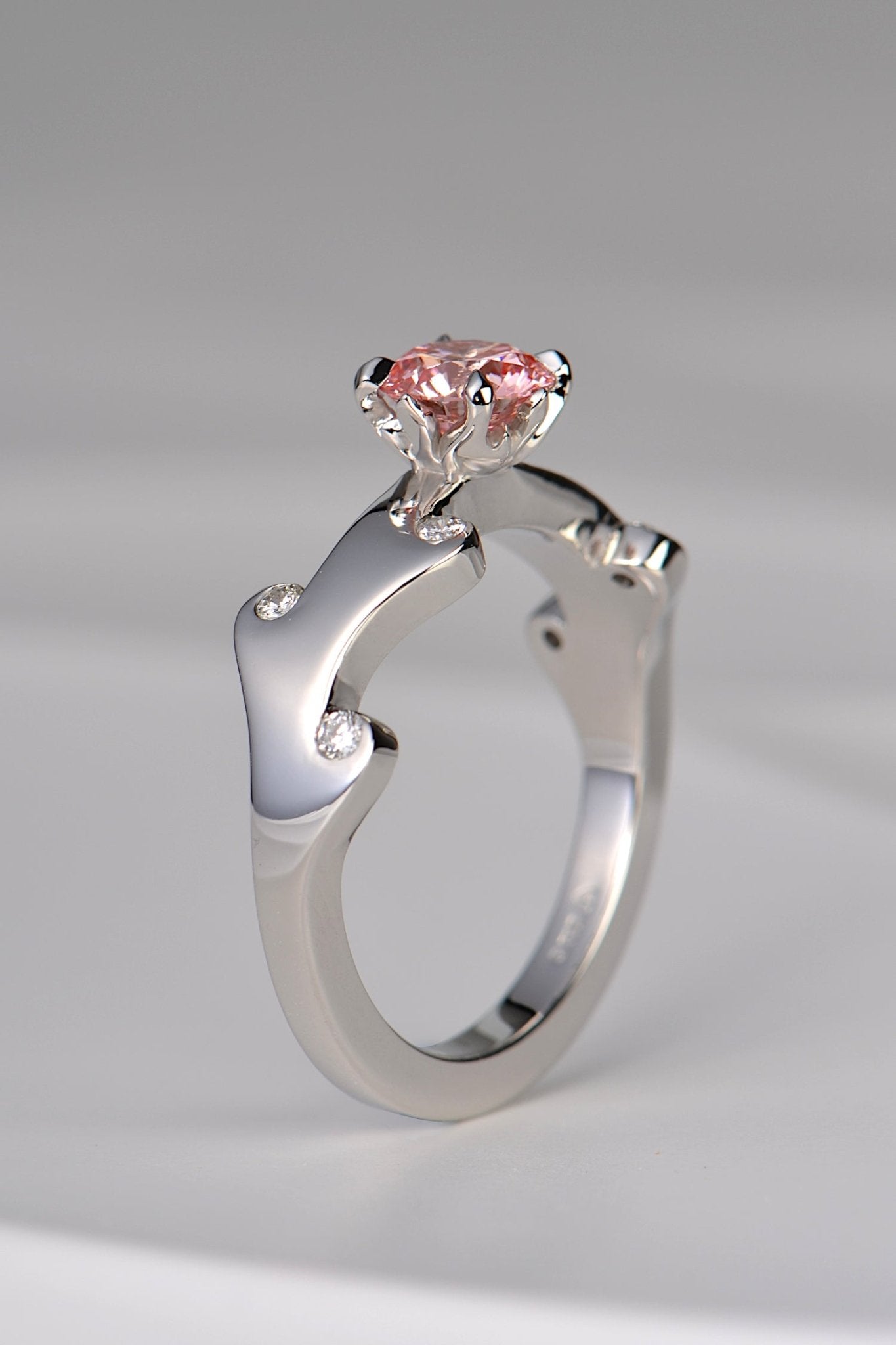 Gorgeous warm rose pink lab diamond platinum ring with a very unusual fire design available exclusively from Christine Sadler