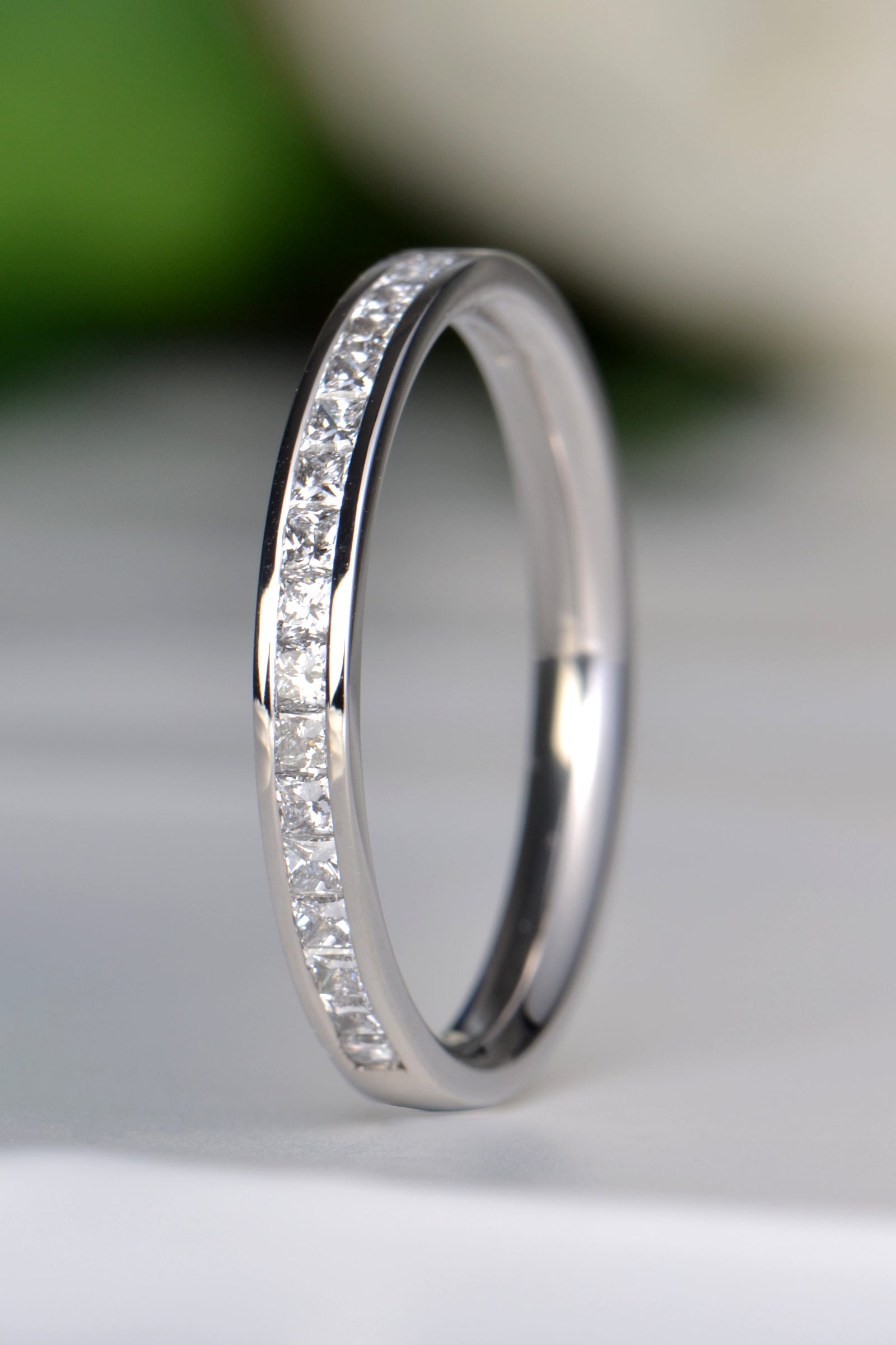 Platinum flat court half eternity ring with 17 channel set princess cut diamonds totalling 0.50ct - Christine Sadler