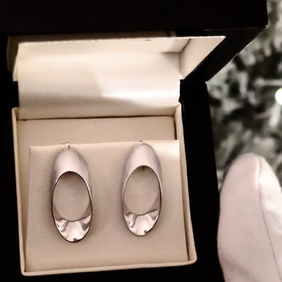 modern silver large stud earrings by jewellery designer Jorge Revilla
