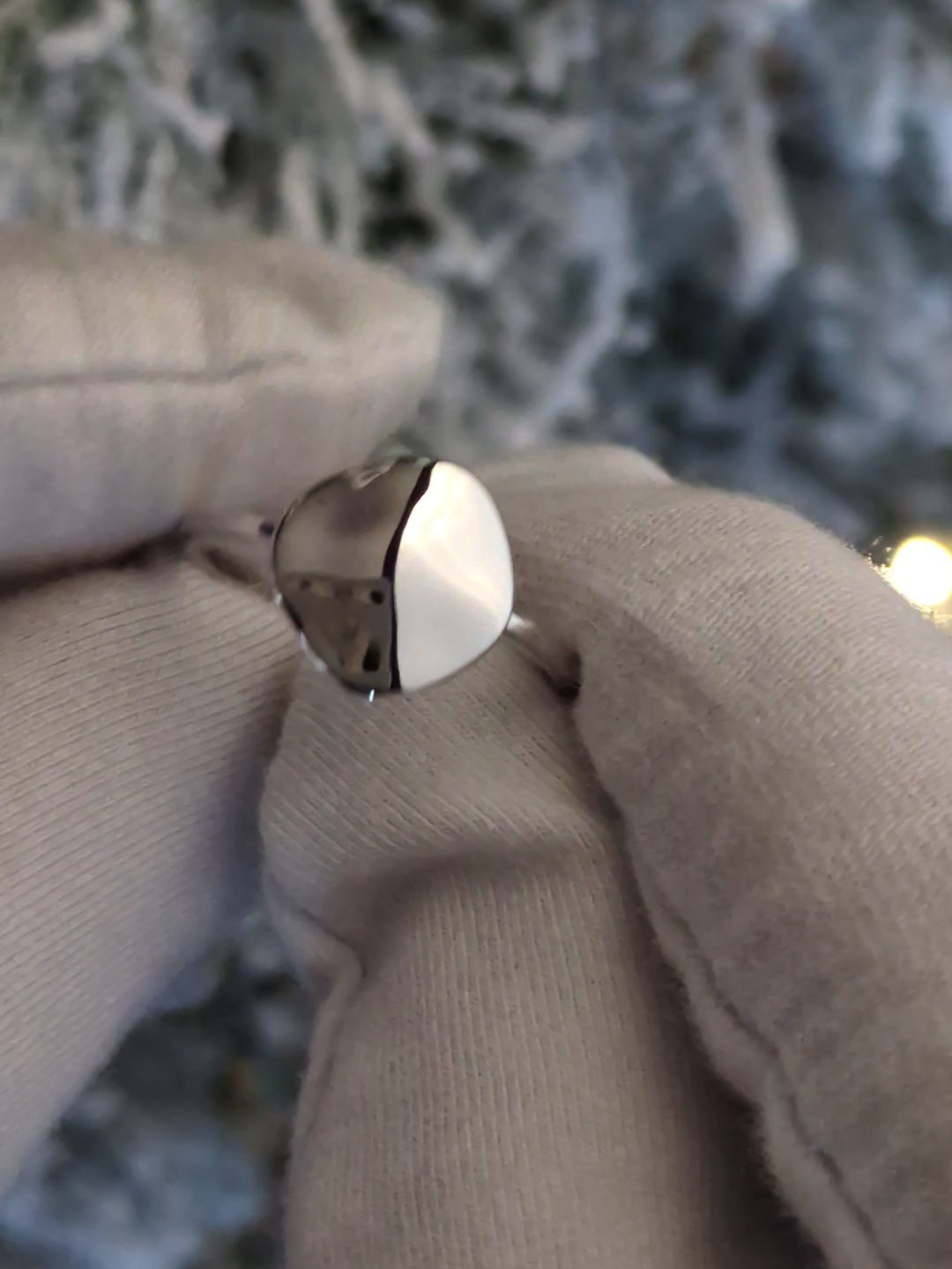 modern delicate designer silver ring that is highly polished