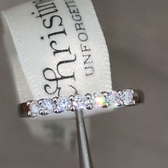 modern Platinum 7-stone half carat ring worn as wedding or eternity ring, handmade in Britain with claw-set diamonds