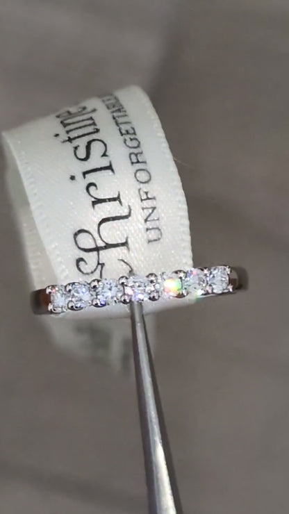 modern Platinum 7-stone half carat ring worn as wedding or eternity ring, handmade in Britain with claw-set diamonds