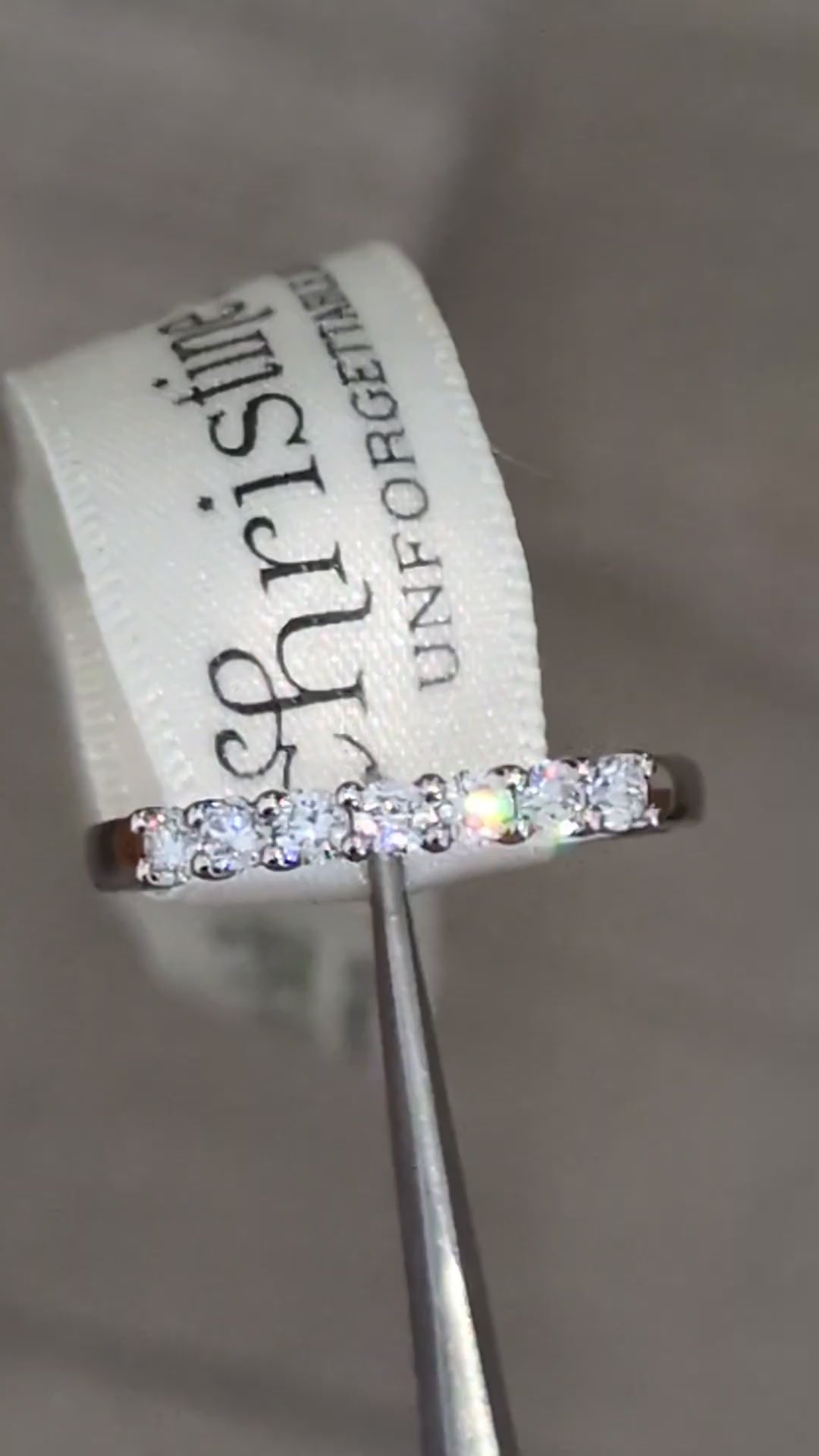 modern Platinum 7-stone half carat ring worn as wedding or eternity ring, handmade in Britain with claw-set diamonds