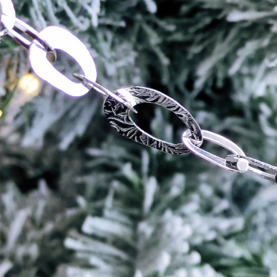 stunning and unusual high quality sterling silver oval link bracelet with a frost pattern on the links from contemporary jeweller Christine Sadler