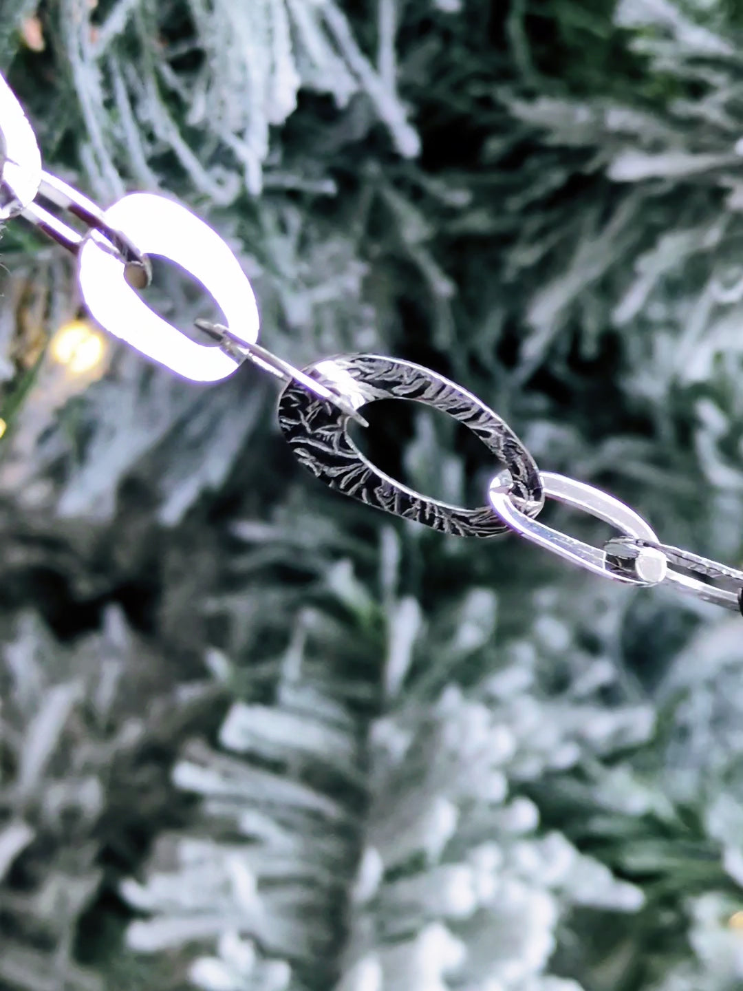 stunning and unusual high quality sterling silver oval link bracelet with a frost pattern on the links from contemporary jeweller Christine Sadler