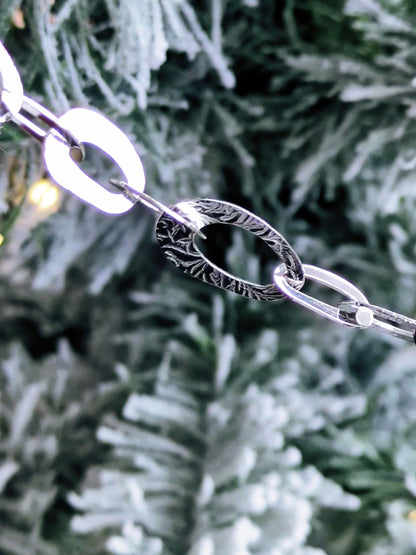 stunning and unusual high quality sterling silver oval link bracelet with a frost pattern on the links from contemporary jeweller Christine Sadler