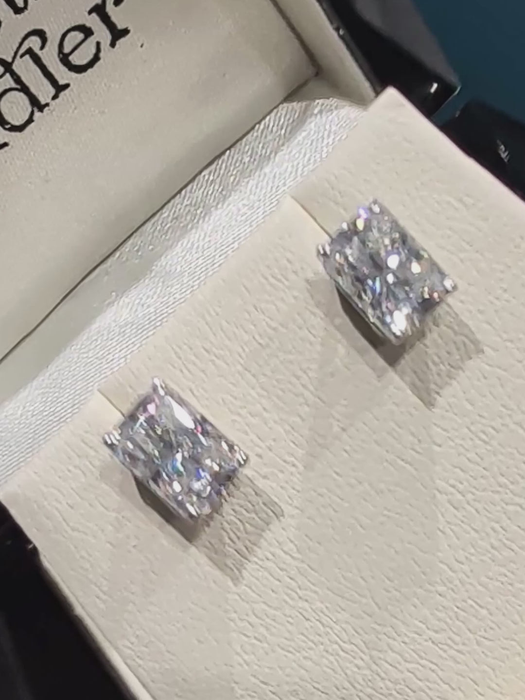 Rectangular radiant cut moissanite 9ct white gold earrings in Christine Sadler branded gift box.