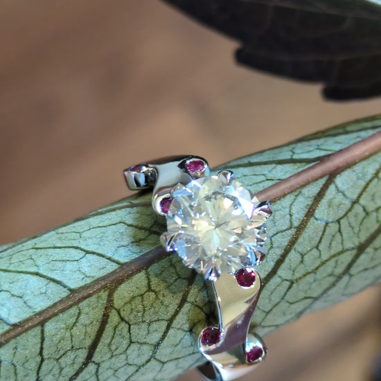 two carat diamond ring set with rubies in a flame romantic design by Christine Sadler