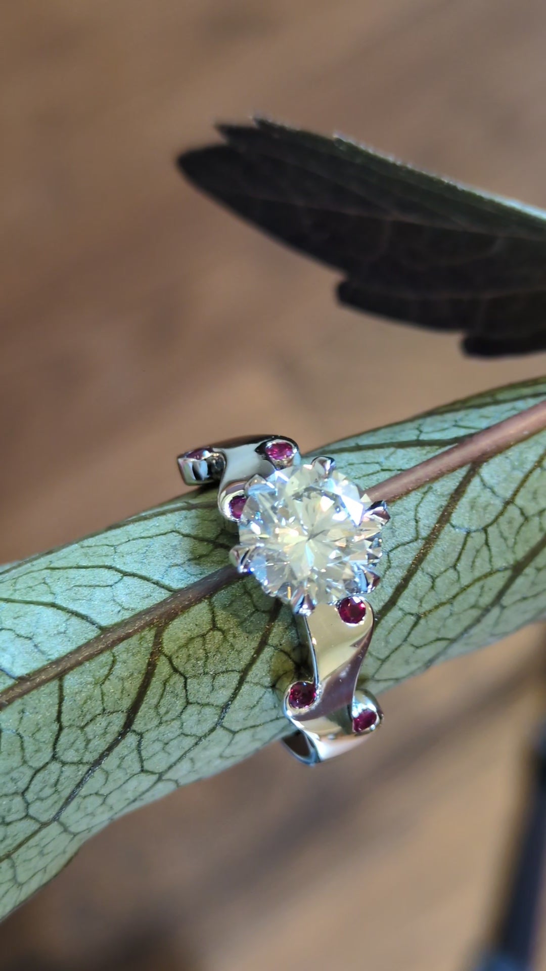 two carat diamond ring set with rubies in a flame romantic design by Christine Sadler