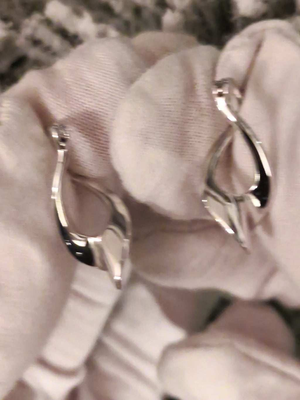 modern designer silver twisted hoop earrings with creole style fitting