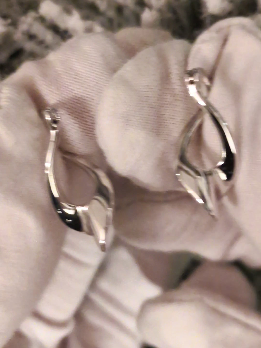 modern designer silver twisted hoop earrings with creole style fitting