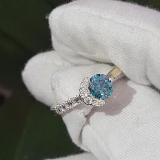 exclusive scottish designer engagement ring inspired by the Fairy Pools on the Isle of Skye. Blue and white diamonds set in 18ct yellow gold designer ring.