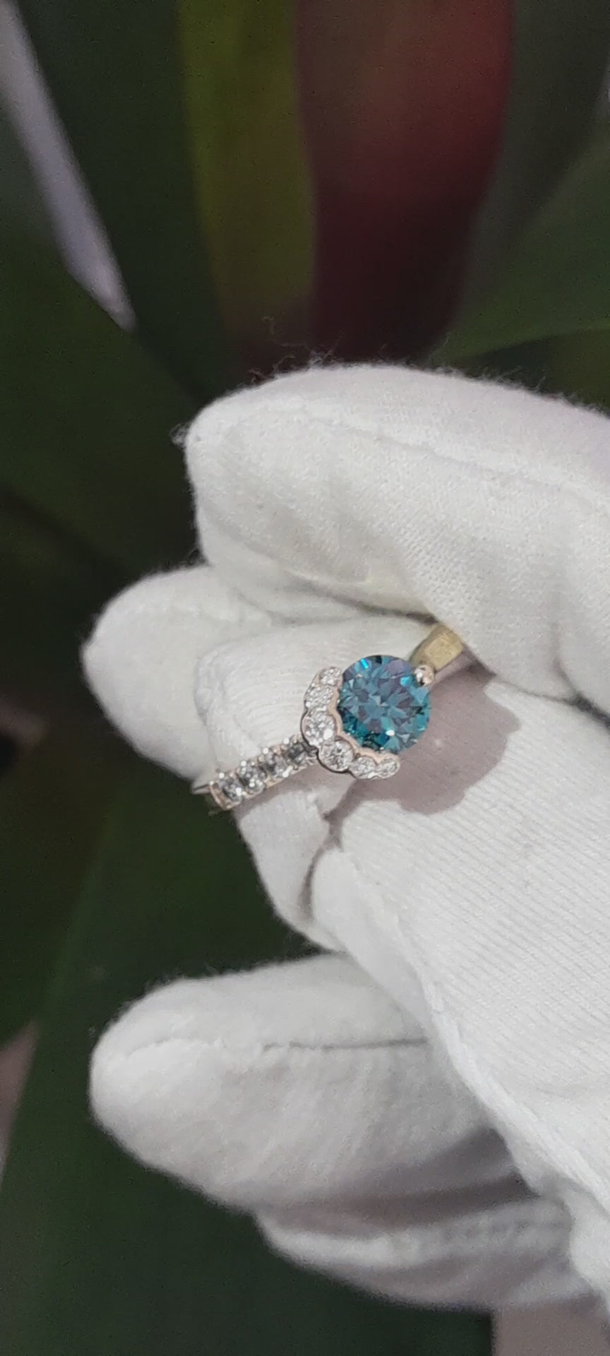 exclusive scottish designer engagement ring inspired by the Fairy Pools on the Isle of Skye. Blue and white diamonds set in 18ct yellow gold designer ring.