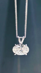 Video demonstrating the light performance and intense sparkle of an East-West 2-carat oval lab diamond pendant - Christine Sadler