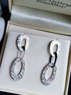 textured large designer earrings with three interlocked oval links. These high quality silver earrings have a pattern inspired by the natural beauty of frost.
