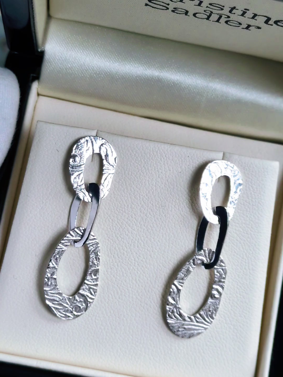 textured large designer earrings with three interlocked oval links. These high quality silver earrings have a pattern inspired by the natural beauty of frost.