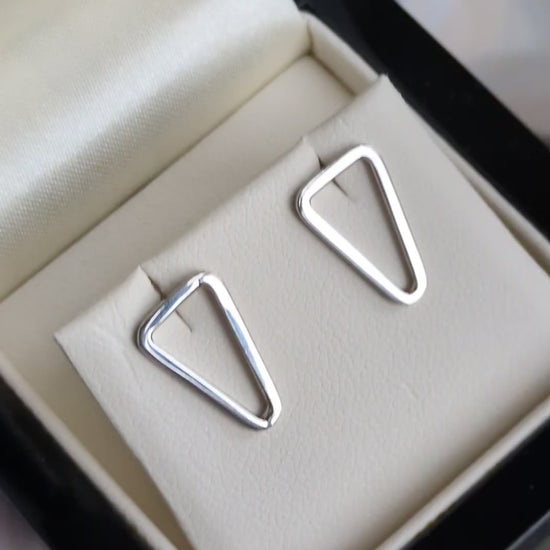 polished silver triangle stud earrings in branded presentation box