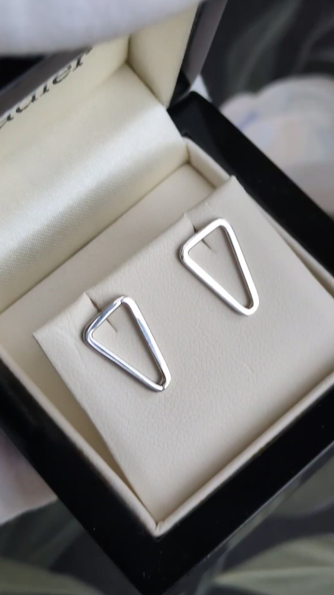 polished silver triangle stud earrings in branded presentation box