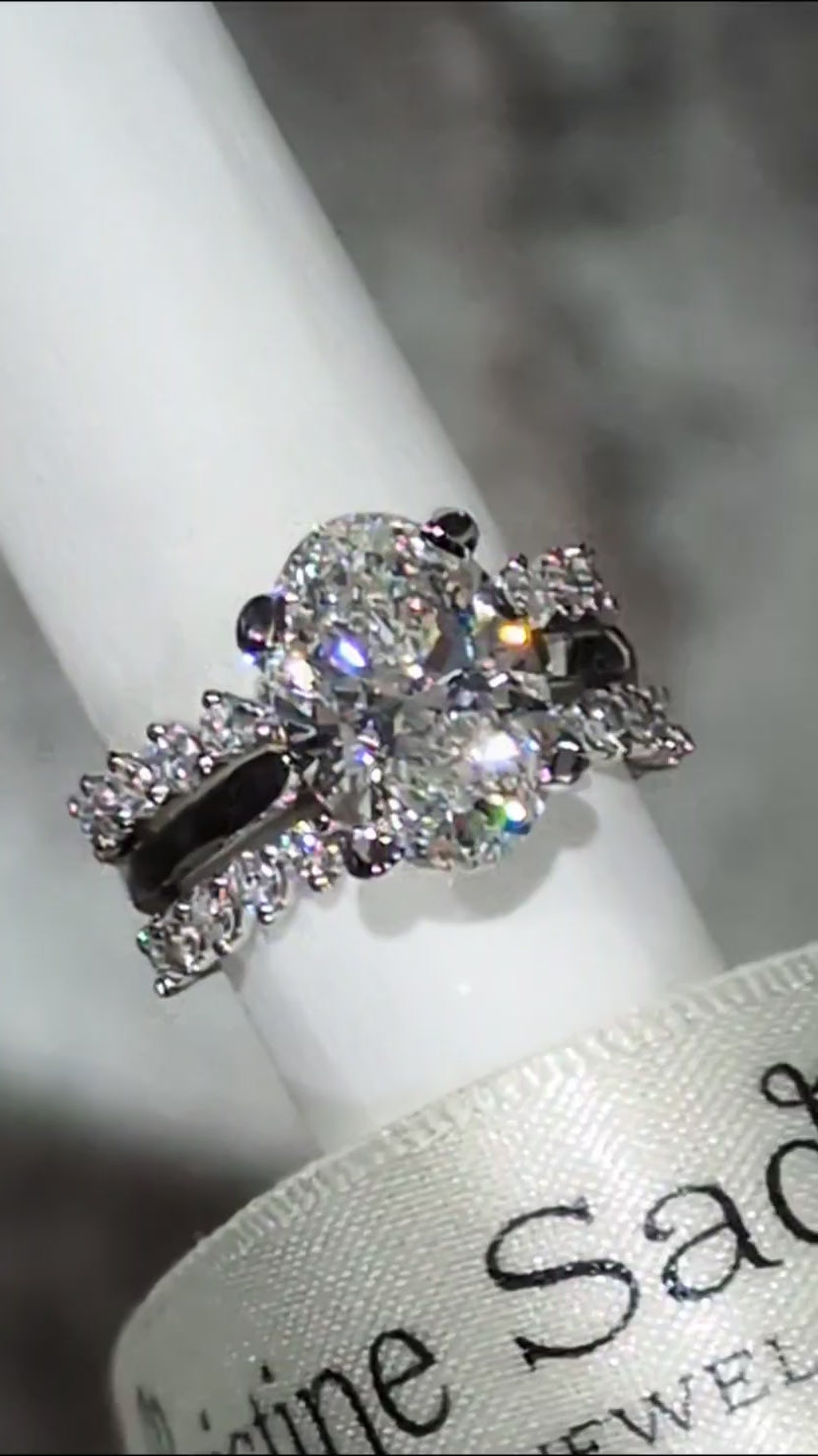 two modern guard diamond rings with a three carat oval lab diamond ring - Christine Sadler