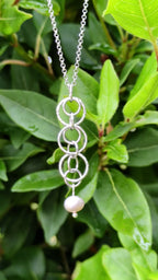 cultured pink pearl silver necklace handmade from interlocking circles on a 45cm long silver rolo chain that is adjustable in length from Christine Sadler