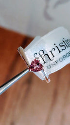 Pink sapphire heart cut gemstone in yellow gold twist ring