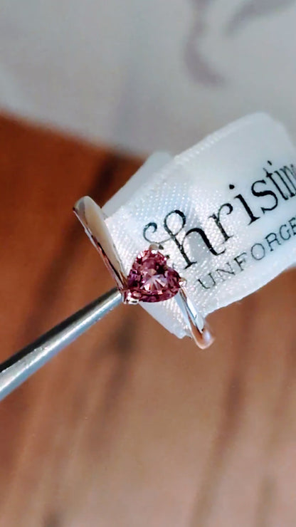 Pink sapphire heart cut gemstone in yellow gold twist ring