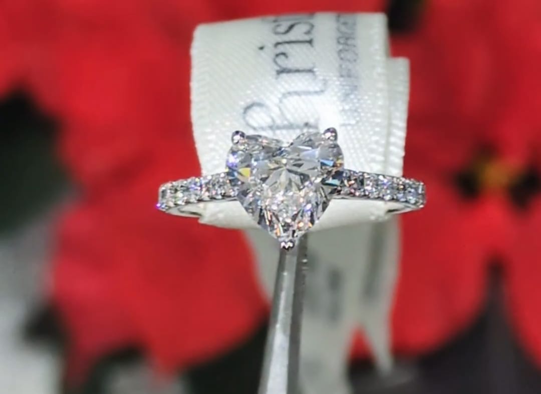 modern engagement ring with heart cut lab diamond in platinum